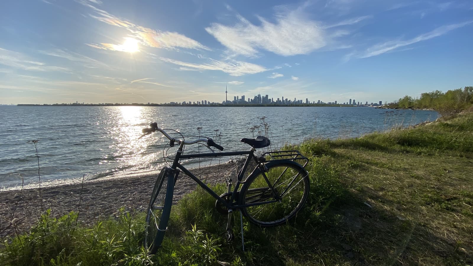Bicycle beside Lake Ontario with the Toronto skyline across the water