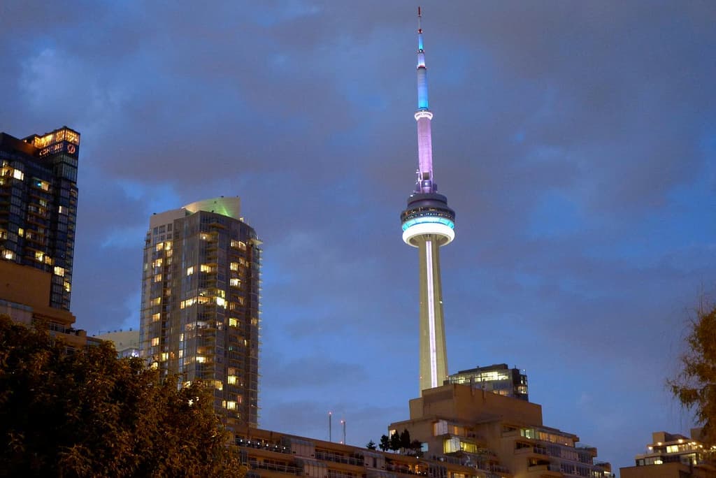 The CN Tower and downtown Toronto skyline in full colour at dusk from Harbourfront