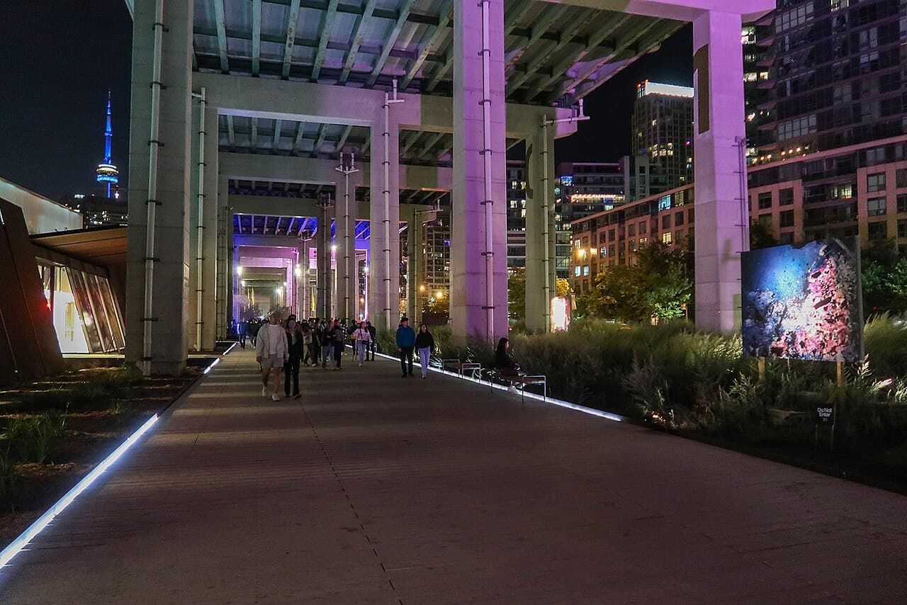 People walking beneath the Gardiner at The Bentway near Garrison Common
