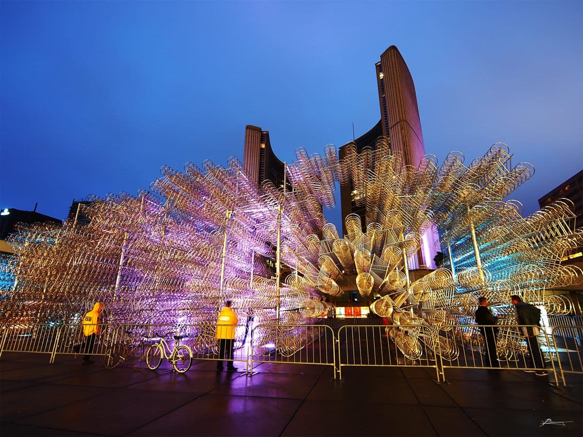 Illuminated bicycle frames in Ai Weiwei's Forever Bicycles installation outside Toronto City Hall during Nuit Blanche 2013