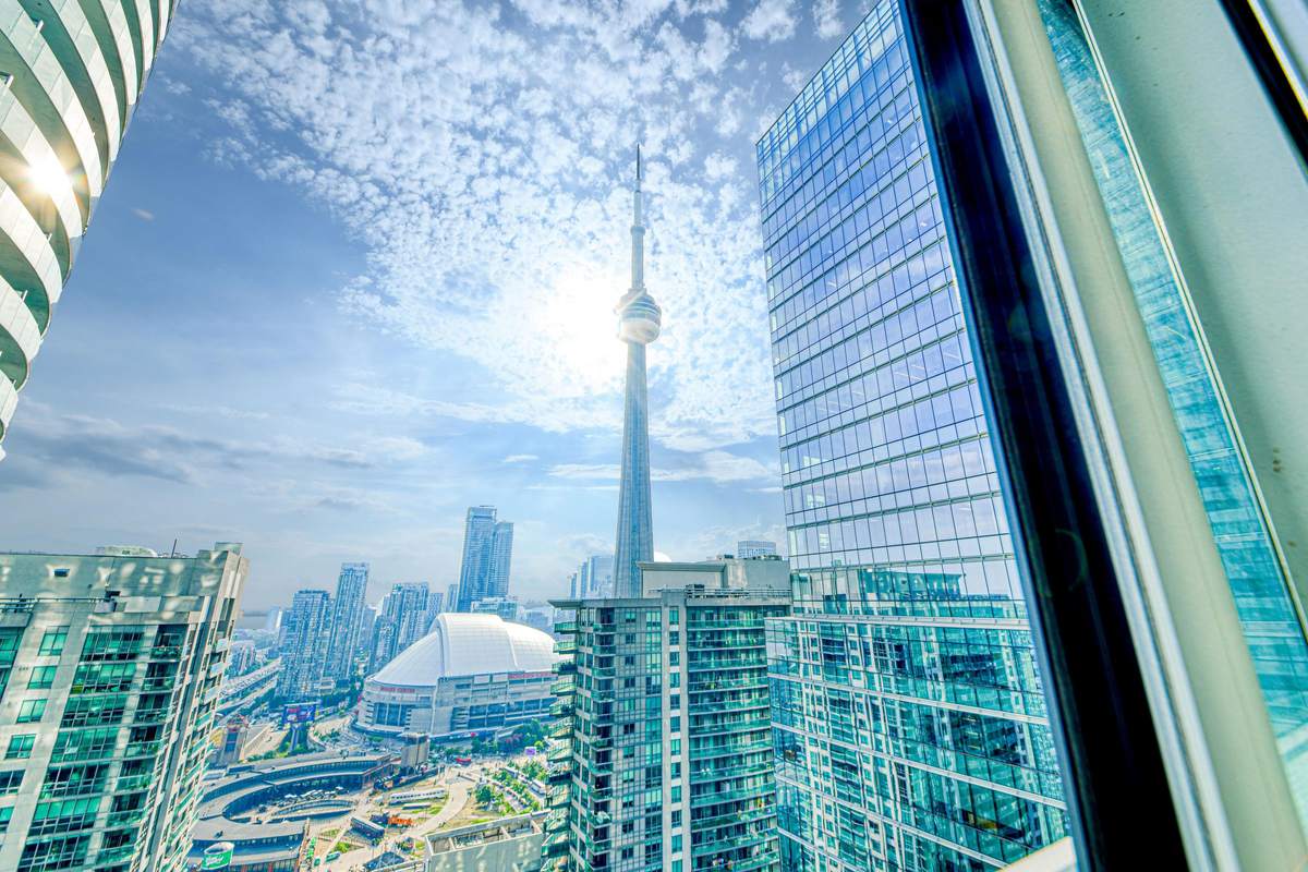 CN Tower and Rogers Centre seen through the window of one real StayToronto York suite