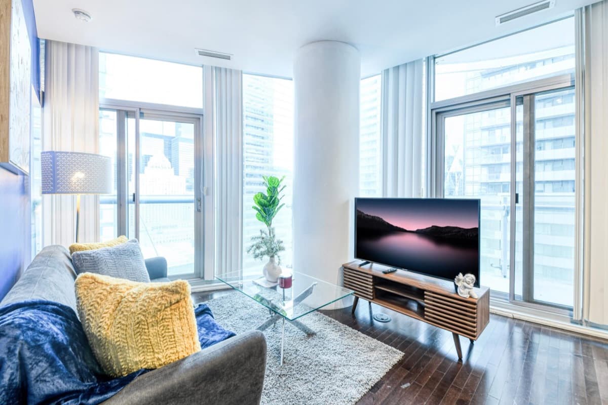 Living room in a real StayToronto York one-bedroom suite near Union Station, a downtown base for Rogers Stadium concerts