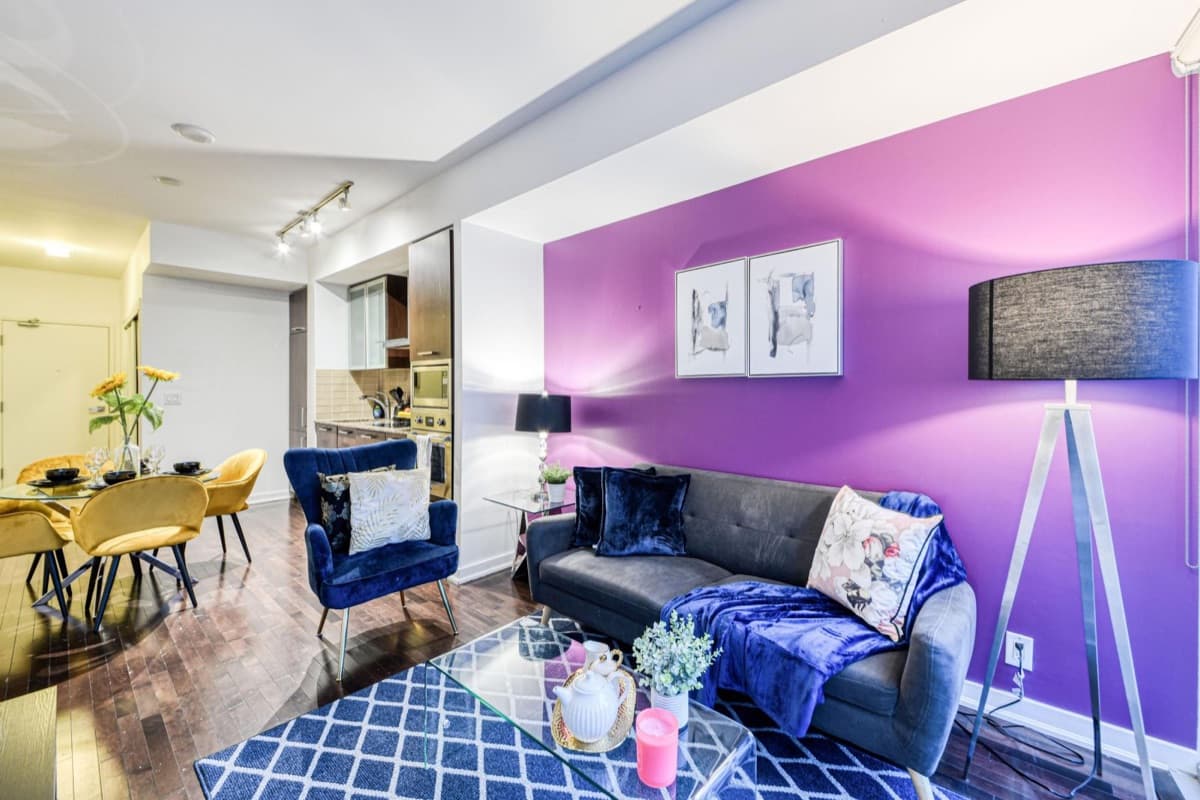 Dining table, kitchen and living area in a real StayToronto York furnished suite in South Core Toronto