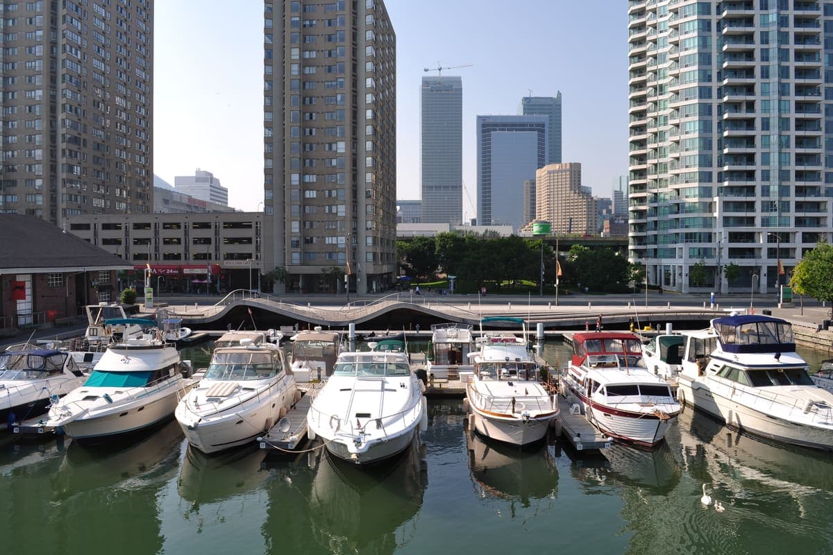 Boats in the harbour with the curved Simcoe WaveDeck behind them