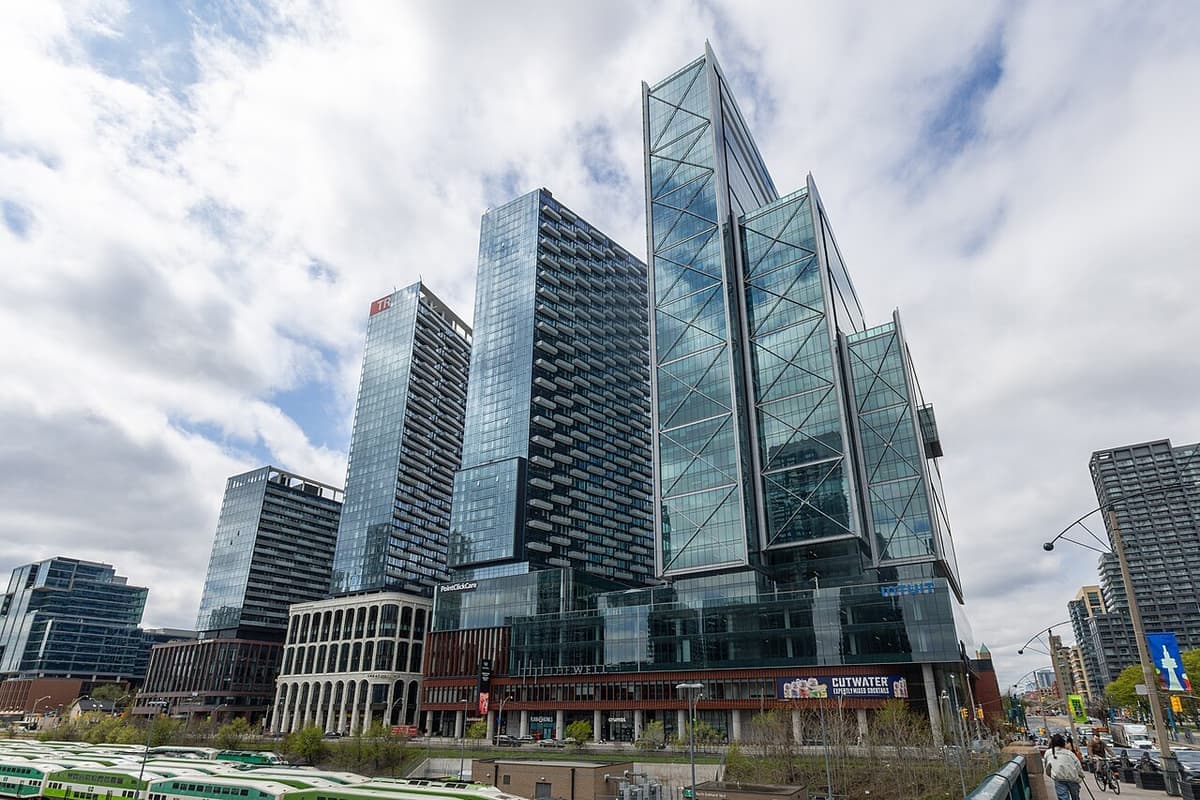 The glass towers and covered public space of The Well seen from Spadina Avenue