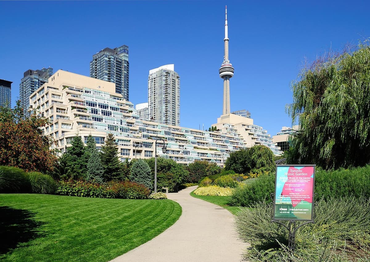 Curving garden paths, lawn and planting at the Toronto Music Garden beside the waterfront