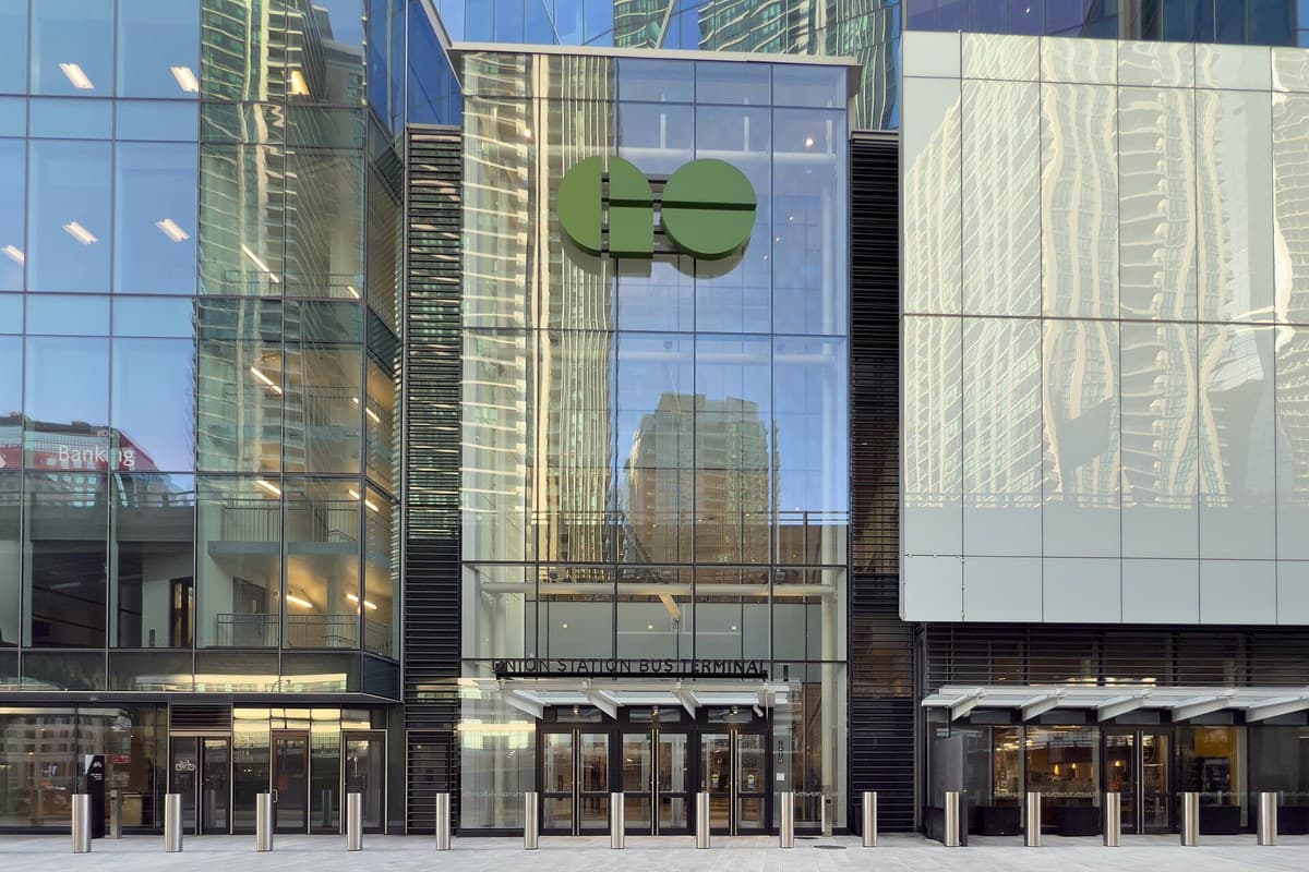 Glass exterior and GO logo above the Union Station Bus Terminal entrance at CIBC Square in Toronto