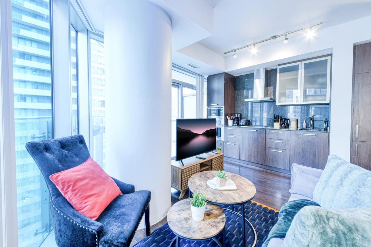 Living room and kitchen in a real StayToronto York one-bedroom suite near the downtown Toronto arenas