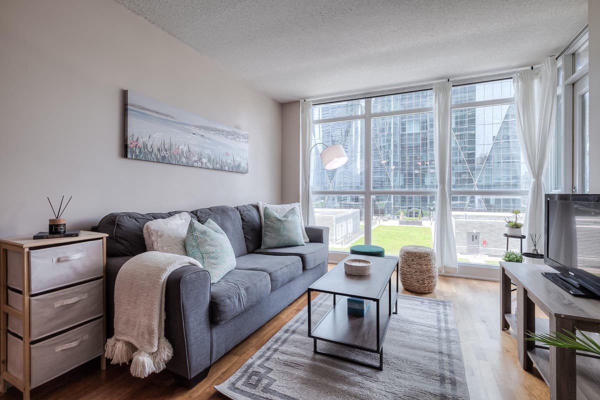 Living room and sofa in a real Yonge one-bedroom with sofa-bed layout