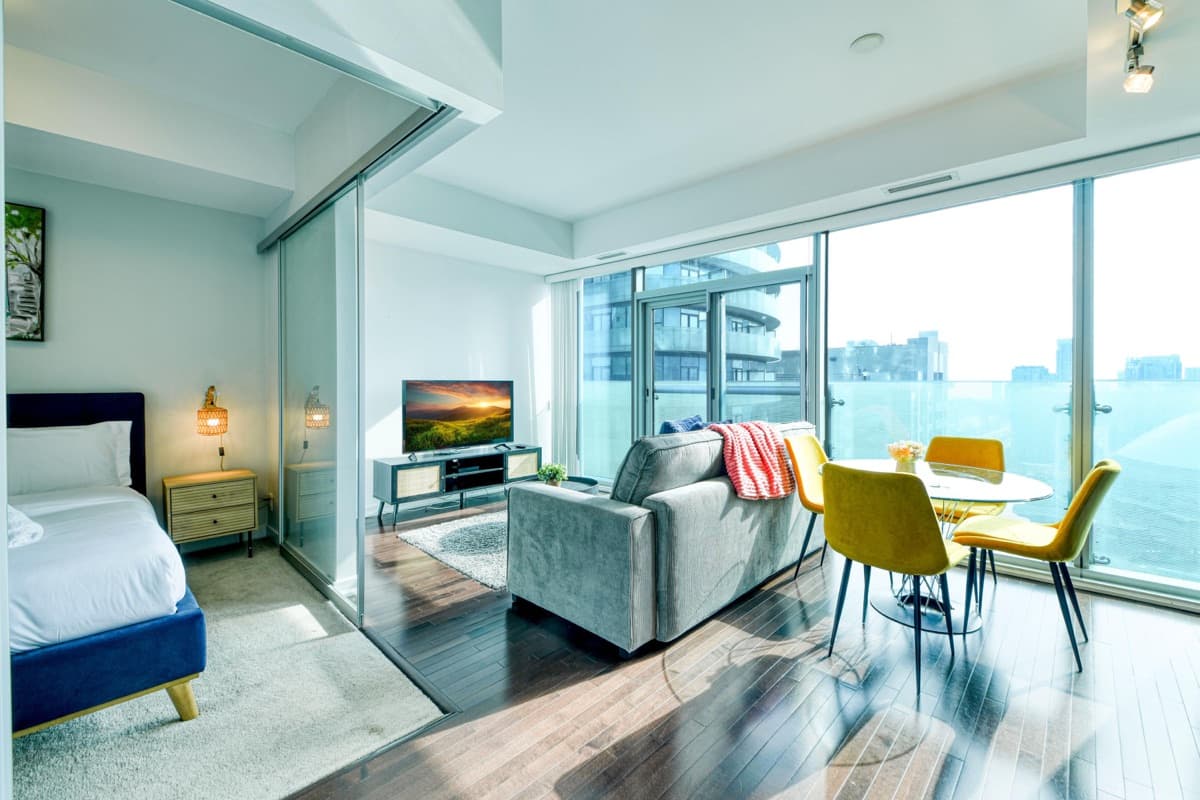 Living room and couch in the same real York one-bedroom suite in South Core